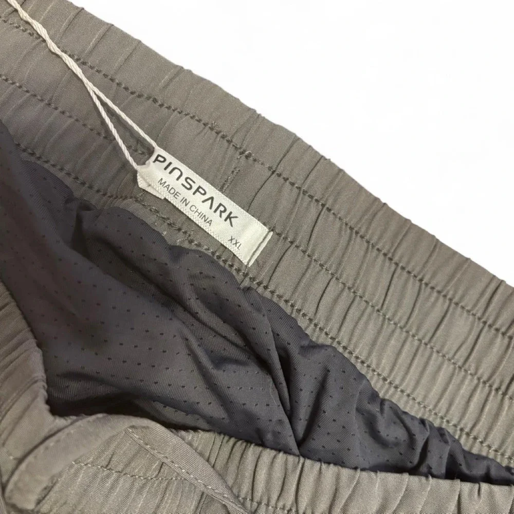 Pinspark athletic running shorts in a versatile khaki/olive color Size XXL